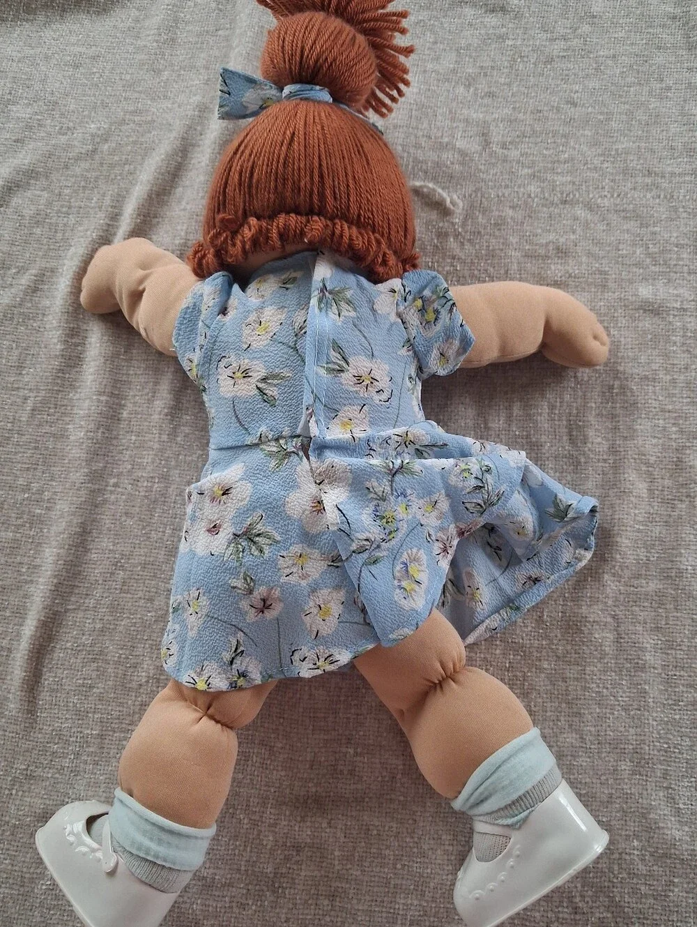 Plush Baby Doll with Blue Floral Dress and Curly Red Hair